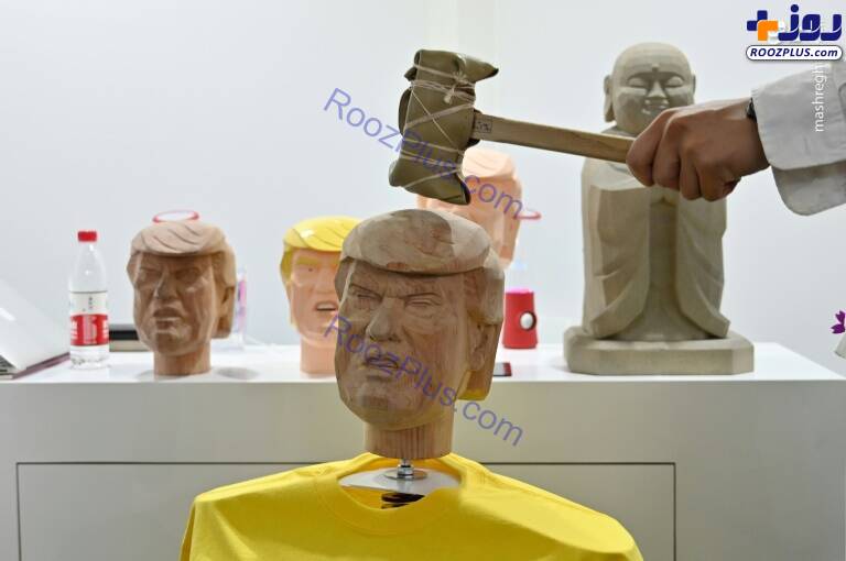 عکس/ کتک زدن مجسمه ترامپ در نمایشگاه چین