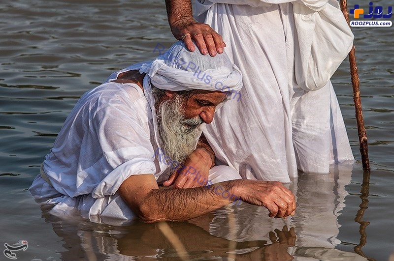 عکس/ غسل تعمید مندائیان در رود کارون