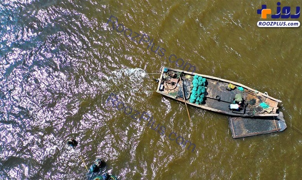 فعالیت ماهیگیران پس از شکست کرونا در چین+ عکس