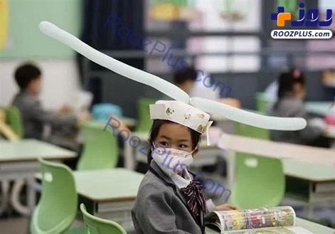 کلاه یک متری بر سر دانش آموزان چینی به خاطر کرونا! +تصاویر