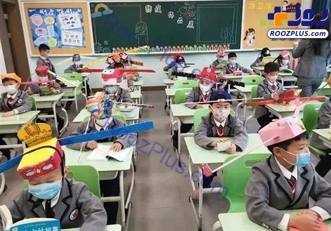 کلاه یک متری بر سر دانش آموزان چینی به خاطر کرونا! +تصاویر
