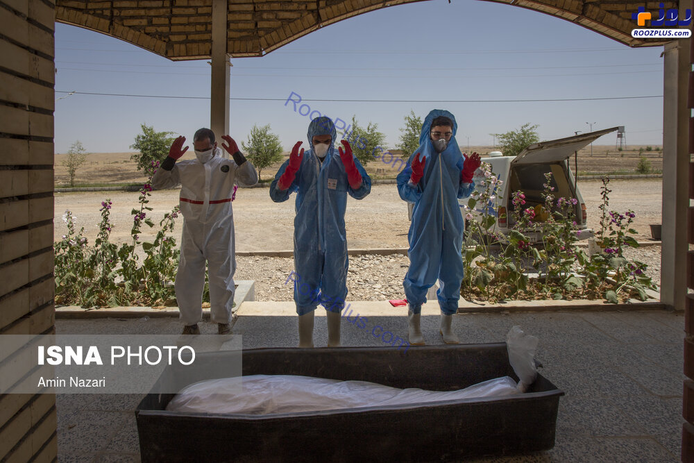 غسل قربانیان کرونا در آرامستان باغ رحمت دزفول +عکس